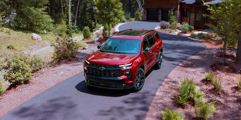 High-angle shot of a red Traverse parked on a driveway.