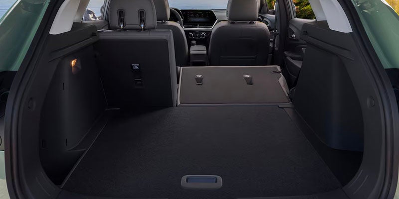 Empty cargo space of a car with the rear seats folded.